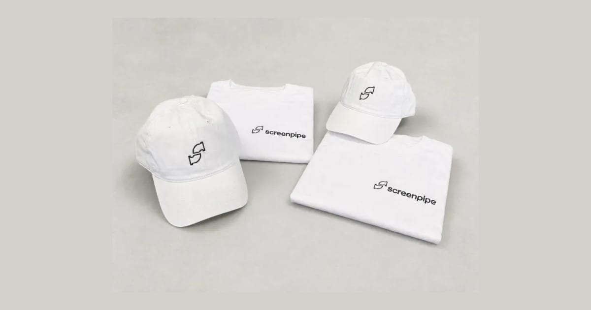 White screenpipe tees with small chest wordmarks and white caps with embroidered pipe logos
