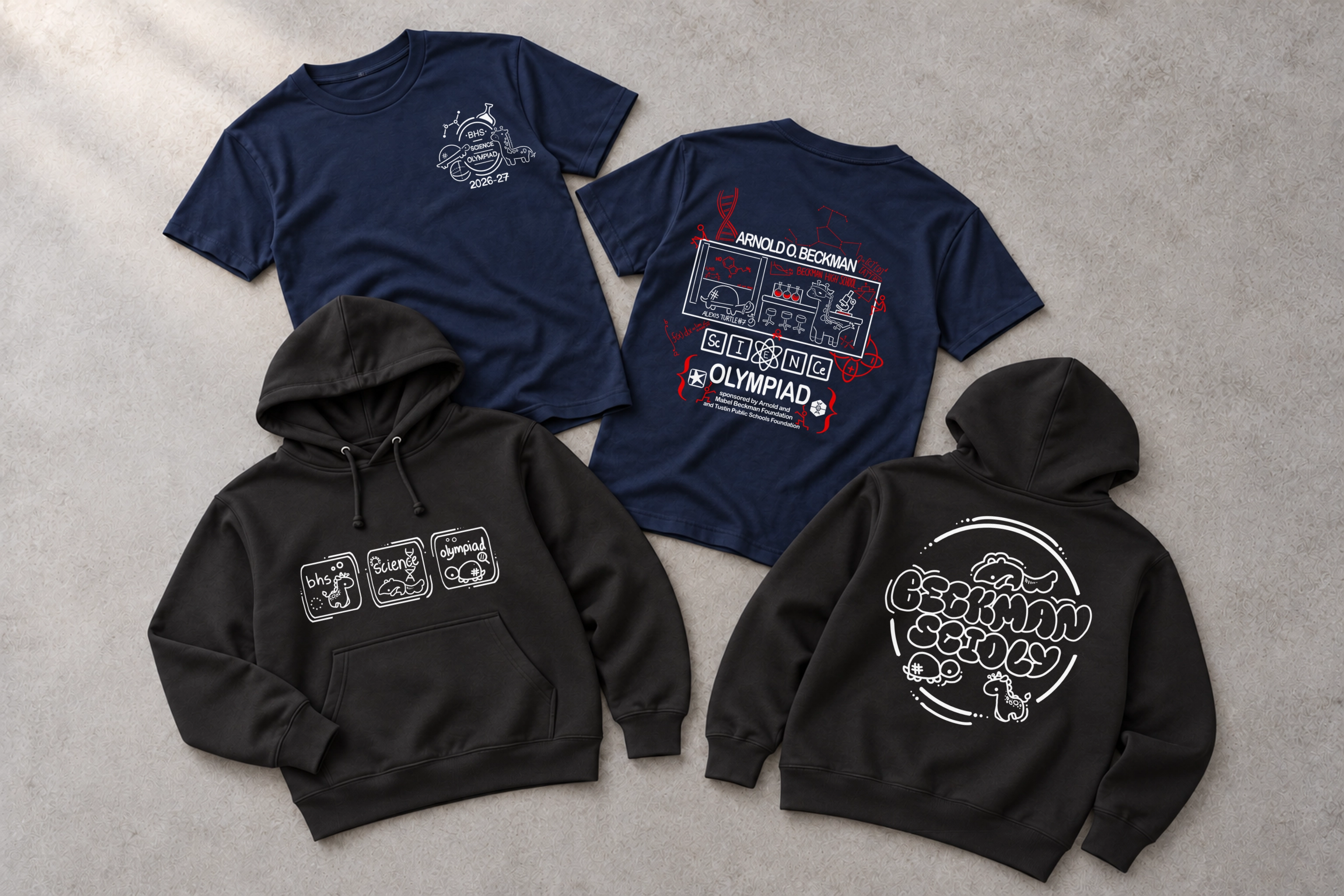Official Beckman Science Olympiad artwork on studio mockups based on the navy Gildan 5000 tee and black Independent Trading Co. SS4500 hoodie, arranged on a textured gray studio surface with soft directional light