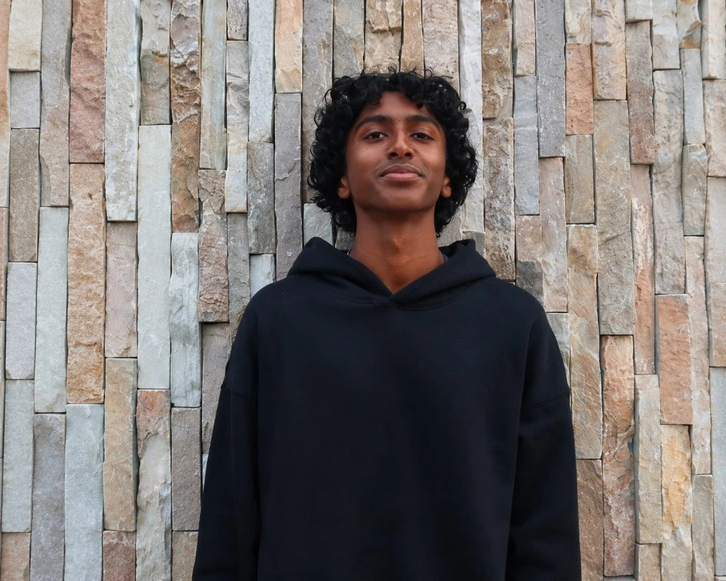 Vibra Balaji wearing a black hoodie
